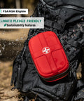 Compact Waterproof First Aid Kit With 130 Piece Emergency Gear For Travel in durable EVA backpack, shown outdoors with water splash.