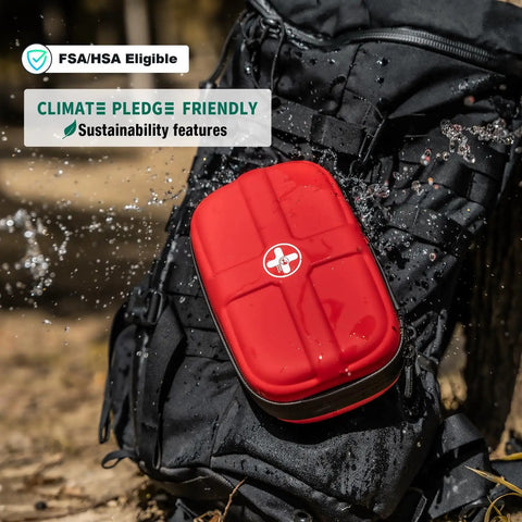 Compact Waterproof First Aid Kit With 130 Piece Emergency Gear For Travel in durable EVA backpack, shown outdoors with water splash.