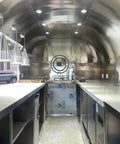Interior view of Heavy Duty Polished Mirror Food Trailer With Foldout Awning Fully Customizable Layout featuring stainless steel surfaces.