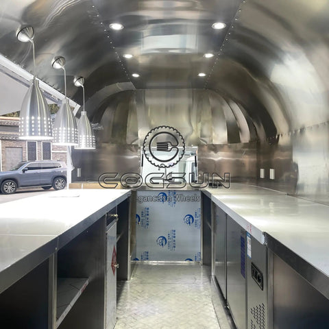 Interior view of Heavy Duty Polished Mirror Food Trailer With Foldout Awning Fully Customizable Layout featuring stainless steel surfaces.