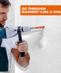 Concrete drill bit set in use with a blue hammer drill and orange-tipped bit on white wall.