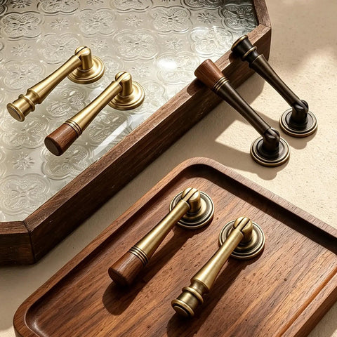 Slick Eight Piece Set Of Black Solid Brass Cabinet Knobs And Drop Style Pulls For Kitchen Drawers And Cupboards With Dang Tough Screw Mount Hardware That Brings Badass Retro Charm To Your Home, showing brass and black handles on wood tray.