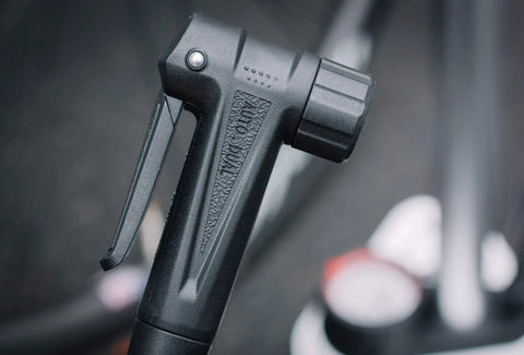 Close-up of the AutoHead on Bike Floor Pump With Industrial Gauge, Durable Aluminum Barrel Up To 160 Psi, 9 Inch Steel Base.