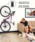 Velo Hinge Two Point Zero Pivoting Bike Wall Mount Single Vertical Bicycle Hanger mounted in living room showing fold away design.