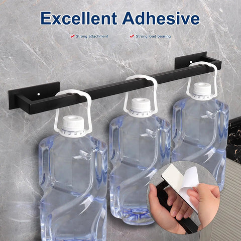 Stick On Stainless Steel Towel Bar 24 Inch Matte Black No Drill Wall Shelf Rack Hang On Towel Holder demonstrating strong adhesive with water containers hanging