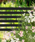 No Dig Plastic Fence Panels 12 Pack Outdoor Privacy Fence Screen For Yard Patio Garden Beds Dual Purpose Dog Fencing AC Unit Hider Black Weatherproof Shield among flowers