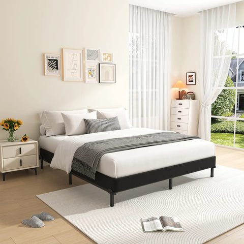 Heavy Duty King Box Spring Low Profile Metal Bed Base With Reinforced Steel Slats And Protective Cover in a bright bedroom setting.