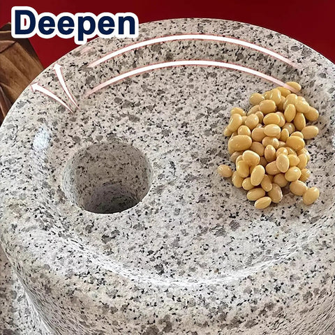 No Fuss Manual Stone Grain Mill with hand crank showing natural granite texture and hole for dry and wet grinding, yellow beans on top.
