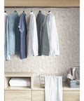 Cream Terrene Peel And Stick Wallpaper For Walls DIY Friendly Removable Self Adhesive Repositionable No Residue Easy To Install Neutral Cream Pattern behind hanging clothes in closet