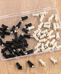 60 Piece 4 Sizes Spring Loaded Cabinet Door Repair Pins Set in black and white for shutters and doors in open box on wood surface