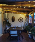 Cozy patio with two pack 100 foot outdoor string lights with dimmable G40 LED bulbs that are shatterproof and weatherproof.