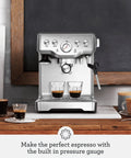 Pro Level Espresso Machine With A Rock Solid Steam Wand For Silky Microfoam And Volumetric Shot Control In Heavy Duty Brushed Stainless Steel Frame on countertop.