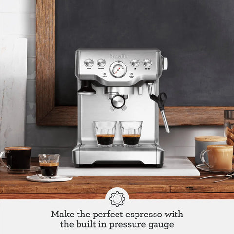 Premium Home Barista Espresso Machine With Manual Microfoam Milk Texturing 1650 Watt Rapid Steam Wand Volumetric Shot Control Black Sesame Finish showcasing two espresso shots.