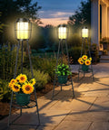 2 Pack Outdoor Solar Lights With Plant Stand And Tall Metal Planter Holder illuminating garden pathway