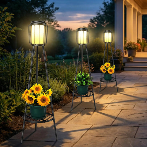 2 Pack Outdoor Solar Lights With Plant Stand And Tall Metal Planter Holder illuminating garden pathway