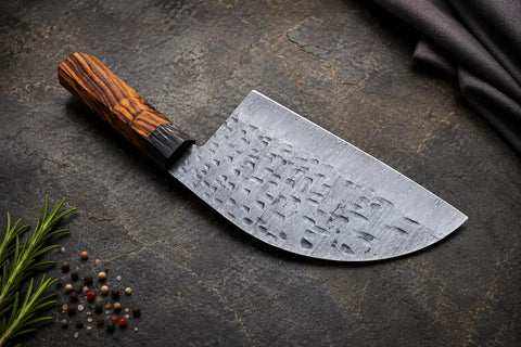 Damascus Steel Chef Knife With 7 Inch Blade And Full Tang on textured surface, showing intricate blade pattern and ergonomic handle