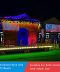 Patriotic Solar Powered LED Flag Net Lights With 420 Bright LEDs decorating a house for outdoor celebrations.