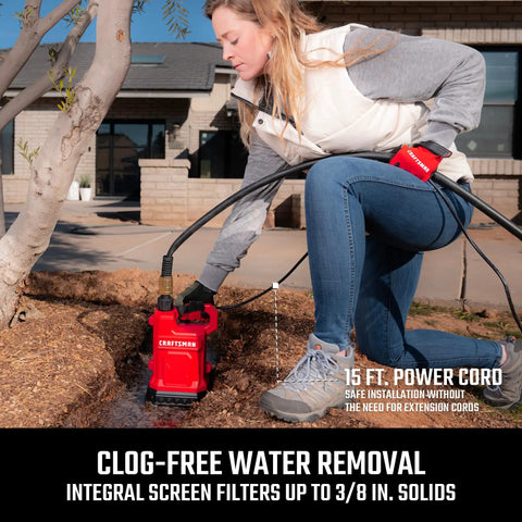 Heavy Duty One Half Horsepower Submersible Water Utility Transfer Pump With 25 Foot Lay Flat Hose in use for yard drainage.