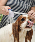 Person using Easy Spray Indoor Outdoor Portable Handheld Sink Sprayer Attachment For Faucets to wash a dog