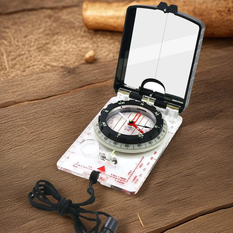 Trail Tested Direction Finder With Mirror Sight, Water Resistant Compass For Hiking And Trekking on wooden surface