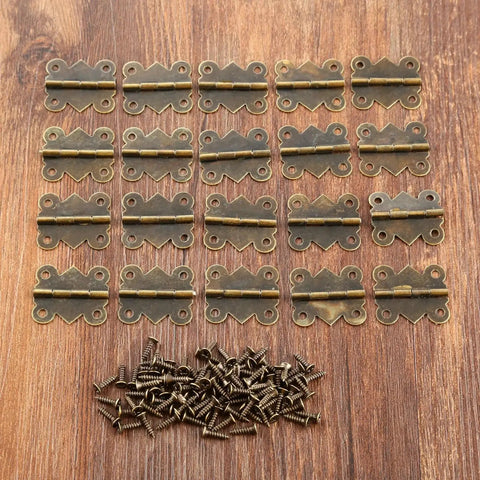 Mini Butterfly Door Hinge Set Antique Bronze 20 By 25mm 20 Pieces with screws on wooden surface