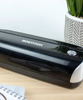 Workhorse Electric 3-Hole Punch for office use, shown on a desk with a black finish, AC or battery powered