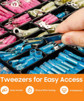 Assorted insulated heat-shrink wire connectors kit with blue and pink terminals in a tray; hand using tweezers.
