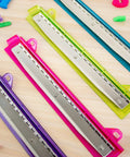 3 Hole Punch For Ring Binders With Integrated Ruler And Five Sheet Capacity Compact Travel Friendly Design in assorted colors