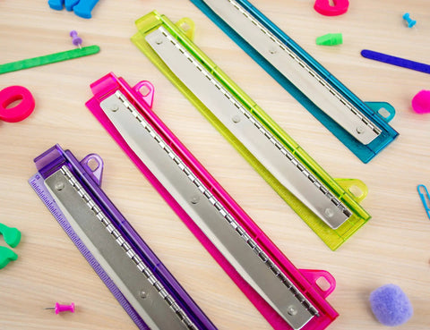 3 Hole Punch For Ring Binders With Integrated Ruler And Five Sheet Capacity Compact Travel Friendly Design in assorted colors