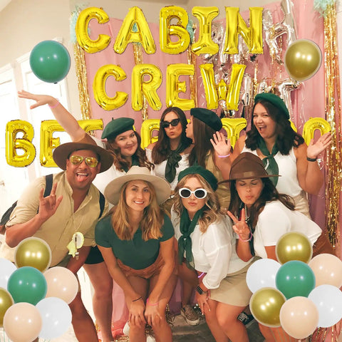 Group posing with Camping Bachelorette Party Kit With Cabin Crew Before I Do Balloons and foil curtain backdrop.