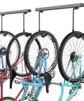 Ceiling Mounted Bike Rack For Garage Indoor Storage Hanger With Adjustable Hooks For 2 To 4 Bikes Heavy Duty Ceiling Carrier Holds Up To 260 Pounds Space Saving And Easy Setup That Makes Garages Cleaner And More Functional showing bikes hanging by wheels