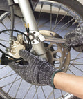 Installing Rear Brake Light Switch Cable Replacement For Motorcycle And Electric Bike with tools near wheel