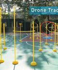 Drone Racing Obstacle Course Kit For Indoor And Outdoor Flying, Beginner Friendly setup with yellow poles and hoops on court