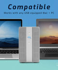 Bulletproof 1TB External SSD RAID Enclosure With Thunderbolt 3 And USB C Ports shown between USB-equipped Mac and PC.