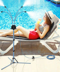 Adjustable Height Standing Misting System For Outdoor Patio Cooling Ranging 2.6 To 5.3 Feet by poolside with woman