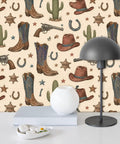 Vintage Wild West Peel and Stick Wallpaper Self Adhesive for Rustic Barn Decor featuring cowboy boots, hats, guns, and cacti.