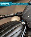Using Bike Torque Wrench One Quarter Inch Drive Five To Twenty Five Newton Meters Micro Click Set on motorcycle seat.