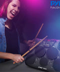 Compact Electronic Digital Drum Kit With Eight Responsive Pads And Kick Pedal Dropping Six Hundred Top Shelf Sounds Usb Midi Integration And Silent Headphone Mode For Night Owl Beat Makers played by a musician.