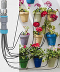 Automatic Drip Irrigation Kit With 10 Drip Emitters And 52 Foot Tubing For Garden Watering shown with potted plants