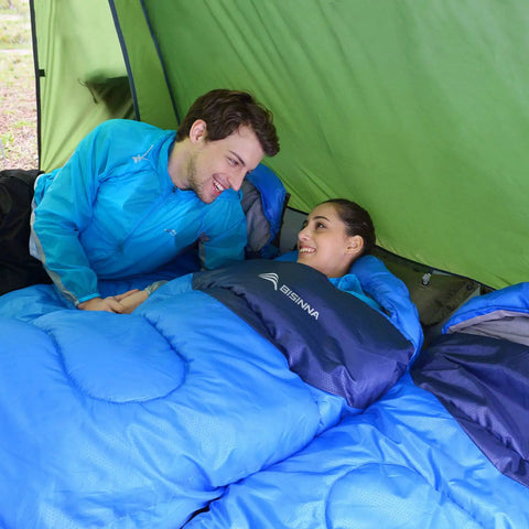 Couple in blue 4 Season Sleeping Bag With Pillow For Camping And Backpacking, Lightweight And Cozy Yet Warm, in green tent