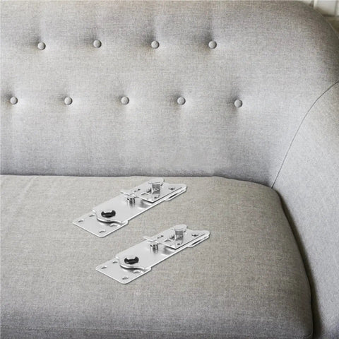 Two interlocking hook plates for Solid As A Rock 10 Piece Heavy Duty Iron Sofa Connector Screws on gray sofa.