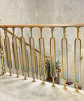 Heavy Duty Aluminum Stair Spindles With Smooth Colored Glass Panels Floor Mounted Deck And Porch Railings Set Of 10 37 Inch Tall view of elegant interior railing with gold finish and tinted glass.