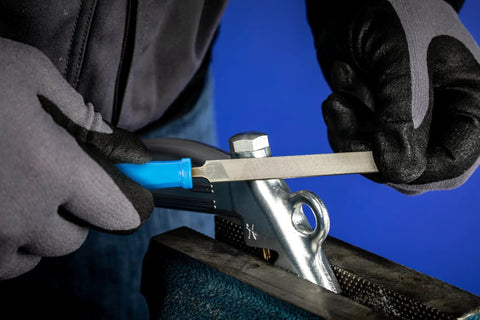 Person using 4 Inch Key File Set 265A 6 Piece Second Cut With Quick Mounting Handle for tool and die making in workshop