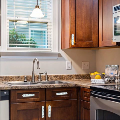 Kitchen view with Blue Starfish Cabinet Pulls 4 Pack Center To Center Three Quarter Inch Silver Nautical Drawer Handles on drawers and cabinets.
