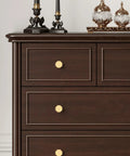 Heavyweight Solid Brass Brushed Gold Cabinet Knobs 0.94 Inch Diameter 24mm on dark wood dresser with decorative items