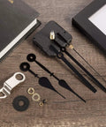 High Torque Long Shaft Clock Movement Mechanism For Wall Quartz Clocks Kit With Two Pairs Of Hands DIY Repair Parts And Motor Replacement Color Set 1 Includes 23 mm Shaft Length on wooden surface