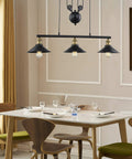 Dining room with Three Light Pulley Pendant Light For Kitchen Island And Dining Room, Lit Industrial Farmhouse Chandelier above table.