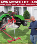 Upgraded Telescopic Lawn Mower Lift Jack For Riding Mowers And Garden Tractors in use lifting a green mower.