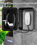 Dang Tough Wall Mount Cover For Electric Vehicle Chargers Built From Rigid Cold Rolled Steel With Rock Solid Locking System Completely Waterproof For Any Rough Outdoor Conditions In Glossy Black, showcasing open cover with charging cable.