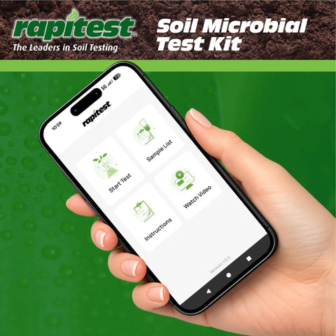 Hand holding smartphone with Soil Microbial Test Kit app for Quick Health Check Of Your Dirt, 5 Tests, Real Results In 10 Minutes.